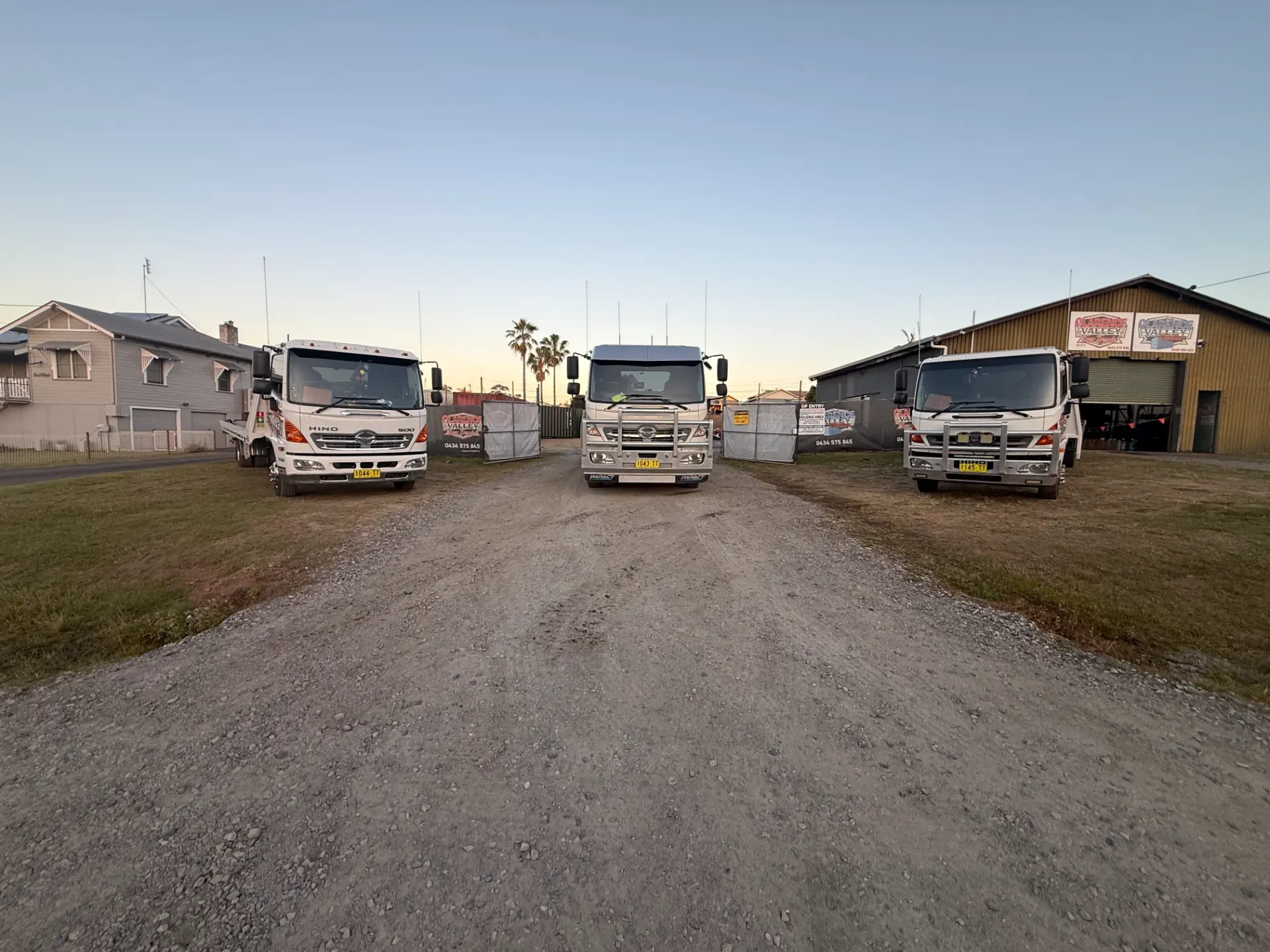 Three tow trucks fanned out across the gravel yard at the South Grafton depot