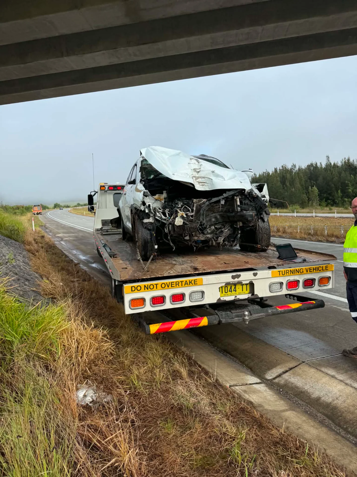A damaged vehicle loaded on a Clarence Valley Tow Trucks tilt tray