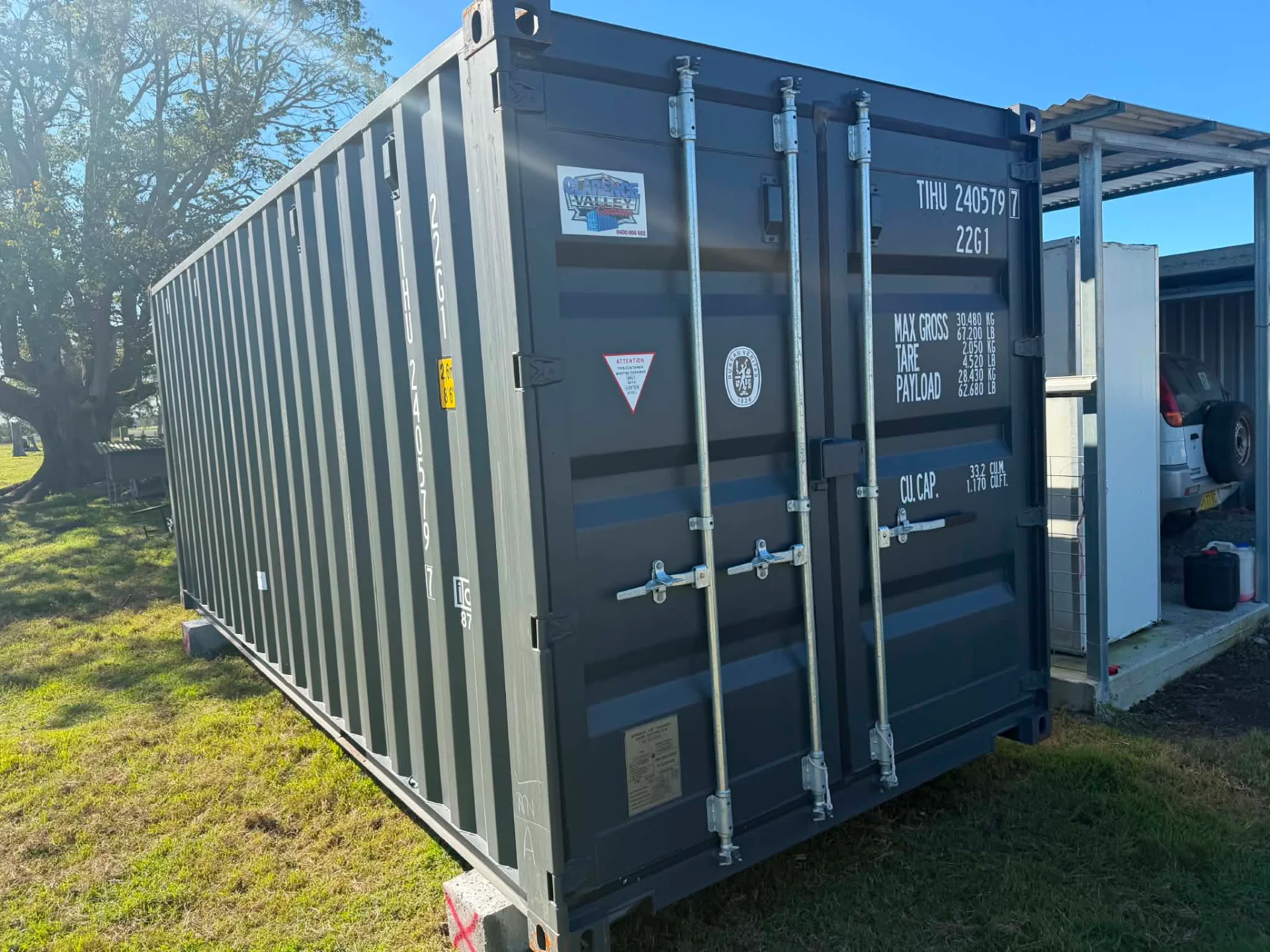 A shipping container for sale, doors open, delivered on site