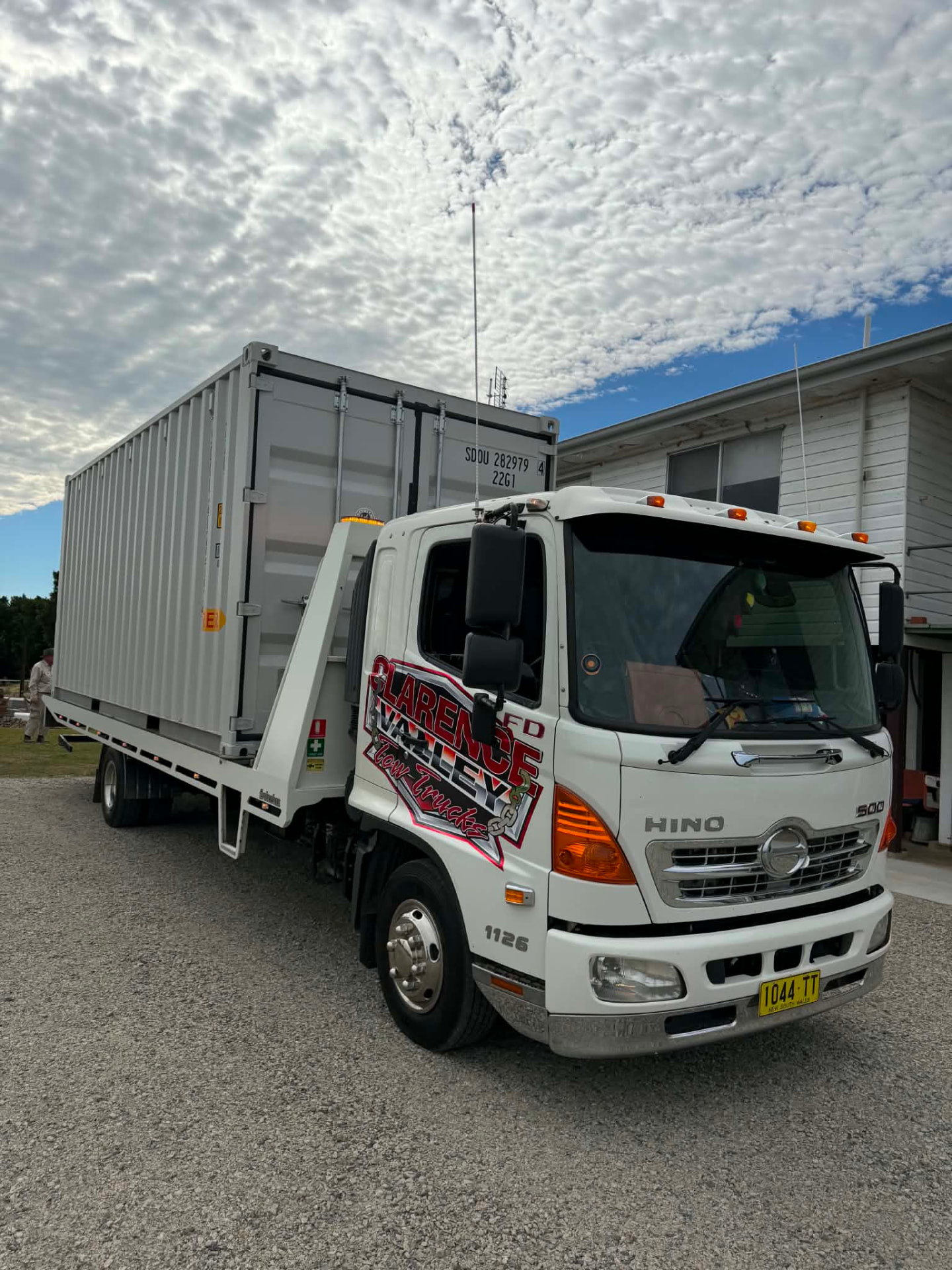 Clarence Valley Tow Trucks tilt tray carrying a shipping container for local delivery